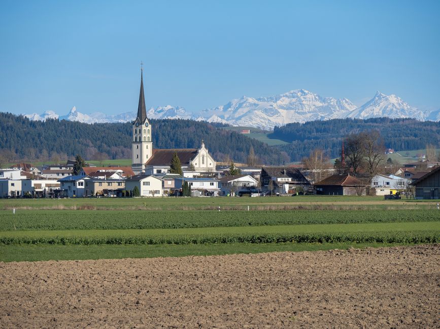 Charming village near Bern, Switzerland with stunning views of the Alps in clear weather.